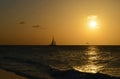 Gorgeous Sun Setting with a Silhoetted Sailboat Royalty Free Stock Photo