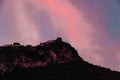 Gorgeous sundown at Amalfy coast, Italy with magnificent luminous colors over mountain with cross