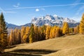 Gorgeous sunny view of Dolomite Alps with yellow larch trees. Colorful autumn panorama view landscape. Royalty Free Stock Photo