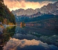 Gorgeous sunrise on Eibsee lake with Zugspitze peak on background.