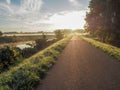 Gorgeous sunrise over the pathway next the river Dyle, Mechelen