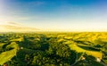 Gorgeous sunset over beautiful green vineyards. Aerial panorama sunset over Austrian grape hills in spring