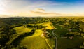 Gorgeous sunset over beautiful green vineyards. Aerial panorama sunset over Austrian grape hills in spring