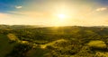 Gorgeous sunset over beautiful green vineyards. Aerial panorama sunset over Austrian grape hills in spring