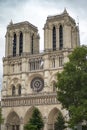 Gorgeous sunset over Notre Dame cathedral with puffy clouds, Paris, France.Notre Dame de Paris - Gothic Catholic Cathedral with Royalty Free Stock Photo