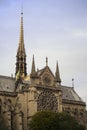 Gorgeous sunset over Notre Dame cathedral with puffy clouds, Paris, France.Notre Dame de Paris - Gothic Catholic Cathedral with Royalty Free Stock Photo