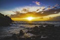 Colorful Sunset with Clouds, Ocean, Waves and Lava Rocks in Wailea, Maui, Hawaii. Royalty Free Stock Photo