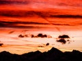 Gorgeous sunset sky over jagged mountain landscape silhouette