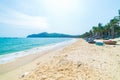 Gorgeous tropical beach turquoise transparent water palm trees, Tu Nham fishing boat and village, Quy Nhon Vietnam central coast