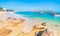 Gorgeous tropical beach turquoise transparent water unique rock boulders, Nhon Hai fishing boat and village, Quy Nhon Vietnam