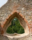 Gorgeous unusual triangle window in church ruins.