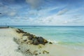 Gorgeous view of Atlantic ocean white sand coast line on turquoise water and blue sky with white clouds background. Royalty Free Stock Photo