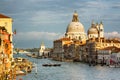 Gorgeous view of Grand Canal and Basilica Santa Maria della Salute during sunset with interesting clouds, Venice Royalty Free Stock Photo