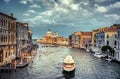 Gorgeous view of the Grand Canal and Basilica Santa Maria della Salute during sunset with interesting clouds, Venice. Royalty Free Stock Photo