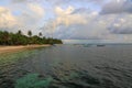 Gorgeous view on Indian Ocean, Maldives. Some boats on blue water and blue sky with white clouds background. Royalty Free Stock Photo