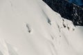 gorgeous view of mountain slope and brave skier sliding down on it. Freeride skiing concept