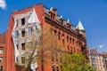 Gorgeous view of old vintage retro building with three dimensional art work on side wall