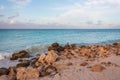 Gorgeous view of rocky coast line landscape. Atlantic ocean turquoise water surface. Pelican flying in blue sky with white clouds Royalty Free Stock Photo