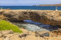 Gorgeous view of rocky coastline of Aruba island on Caribbean sea background with natural Bridge. Royalty Free Stock Photo