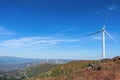 Gorgeous view of rocky mountain landscape with wind turbines in the distance. Beautiful clear blue sky. Aveiro, Portugal Royalty Free Stock Photo