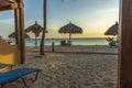 Gorgeous view on sandy beach and Atlantic Ocean from a room. Sun beds and umbrellas on turquoise water and blue sky background.