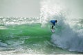 Gorgeous view on ssurfer ride the wave, many splashes in sunbeams on surfing competetion Moche Rip Curl Pro Portugal 2015