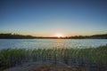 Gorgeous view on sunset on lake on summer day. Lake and sky converging on horizon Royalty Free Stock Photo