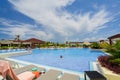 Gorgeous view of swimming pool at Iberostar Playa Pilar resort with people relaxing and enjoying their vacation time on sunny beau