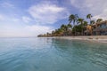 Gorgeous view of Tamarijn hotel buildings on front of sandy coastline of Atlantic Ocean. Turquoise water merging with blue sky. Royalty Free Stock Photo