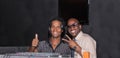 gorgeous view on two DJ energetic smiling funny guys posing for photographer at night disco club