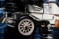 Gorgeous vintage white car with three seats and spare wheels on the back of the vehicle Royalty Free Stock Photo