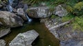 A Gorgeous Waerfalls Flows In A Mountain Envrionment