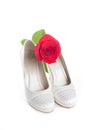 Gorgeous wedding shoes white with a red rose Royalty Free Stock Photo