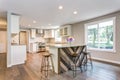 Gorgeous white kitchen with bar style island. Royalty Free Stock Photo