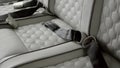 gorgeous white or light gray leather interior. Handmade, diamonds embroidered on light leather in the interior of a Royalty Free Stock Photo