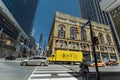 Gorgeous wide open view of Toronto young street with fragment of old and modern buildings, walking people and various trucks Royalty Free Stock Photo