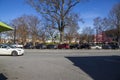 A gorgeous winter landscape at the Marietta Square with bare winter trees, a gazebo and parked cars with a clear blue sky
