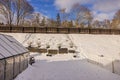 Gorgeous winter view of small garden and greenhouse. Gardening concept.