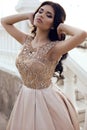 Gorgeous woman with dark hair in luxurious elegant dress Royalty Free Stock Photo