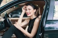 Gorgeous woman laughing, happy while sitting on the front seat i