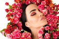 Gorgeous woman makeup face with red roses flower closeup Royalty Free Stock Photo