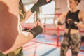 Gorgeous woman, mma fighter in gym during training. Preparing for a hard caged match Royalty Free Stock Photo