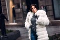 Gorgeous woman posing in luxurious fur coat