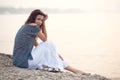 Gorgeous woman sitting on beach Royalty Free Stock Photo