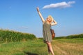 Gorgeous woman in a wheat field on a sunset background. Model in a hat in the forest Royalty Free Stock Photo