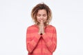 Gorgeous young asian woman with dreadlocks holding hands in namaste or prayer Royalty Free Stock Photo