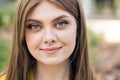 Gorgeous young beautiful caucasian long hair woman looks at camera outside business district. Confident girl. Fashion Royalty Free Stock Photo