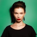 Gorgeous Young Brunette Woman face portrait. Beauty Model Girl with bright eyebrows, perfect make-up, red lips Royalty Free Stock Photo