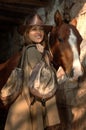 Gorgeous young cowgirl with a horse Royalty Free Stock Photo