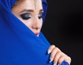 Gorgeous Young East Woman face portrait in hijab. Beauty Model Girl with bright eyebrows, perfect make-up, touching her Royalty Free Stock Photo